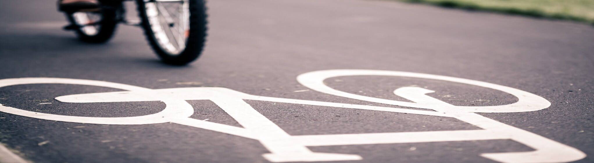 An Image of bike painted in white on the road