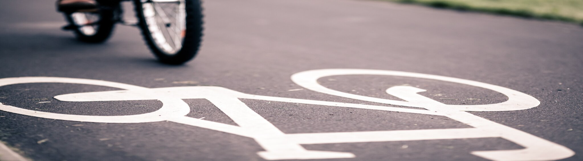An Image of bike painted in white on the road