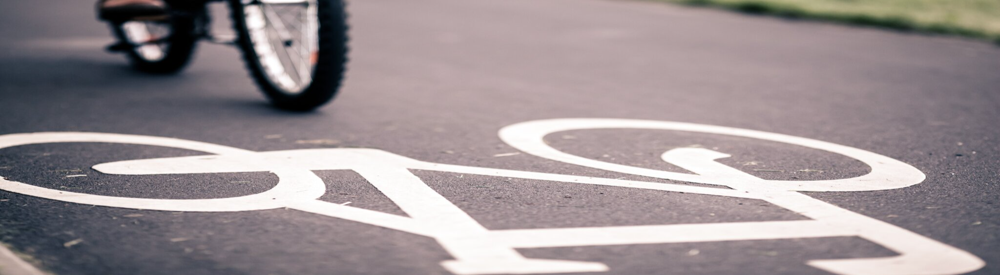 An Image of bike painted in white on the road