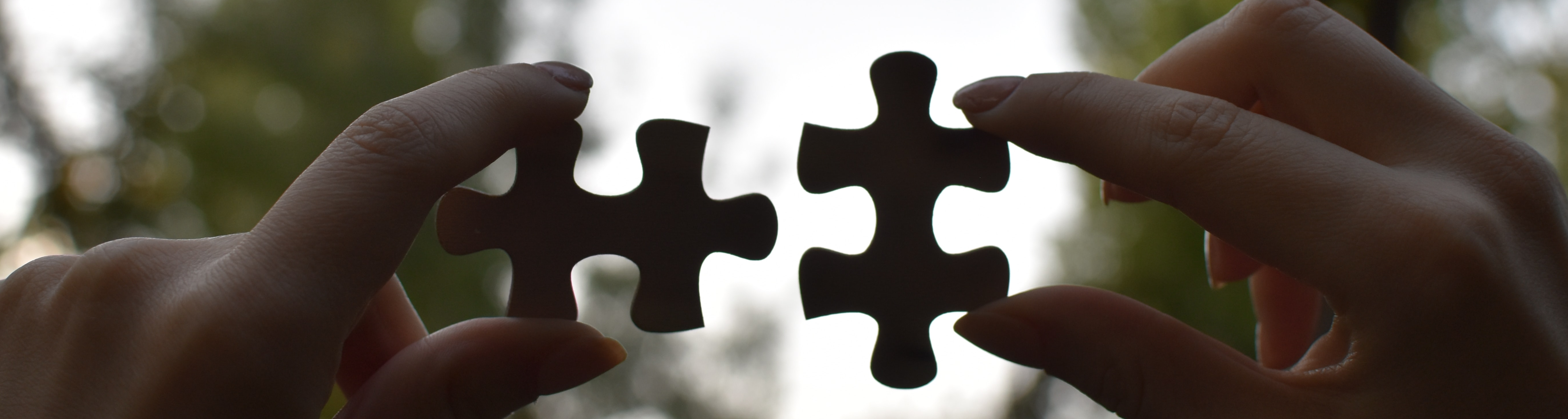 Multicoloured aprons hung on hooks