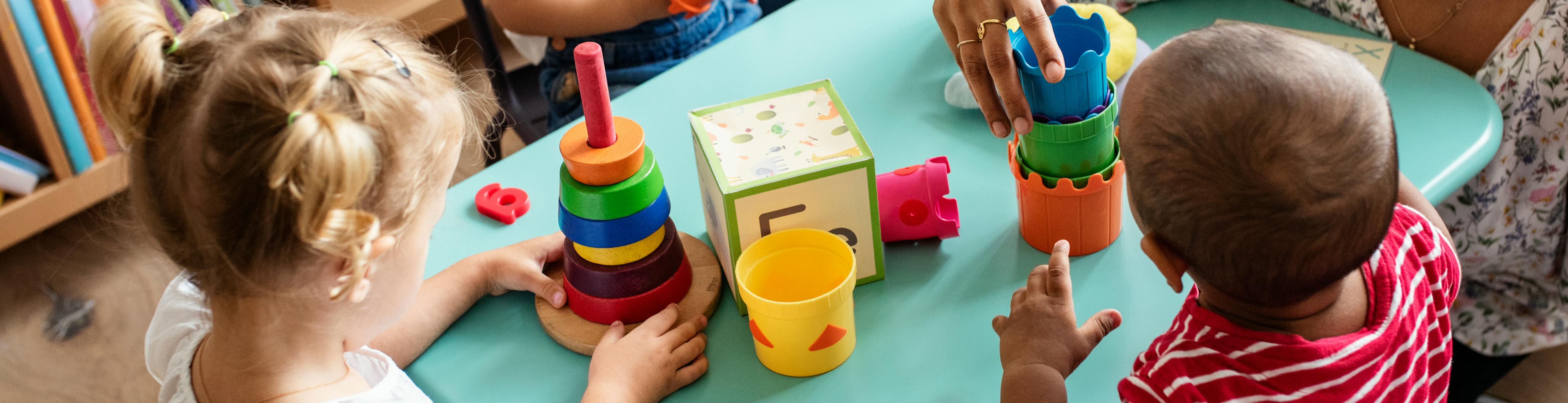 Children playing at activity table