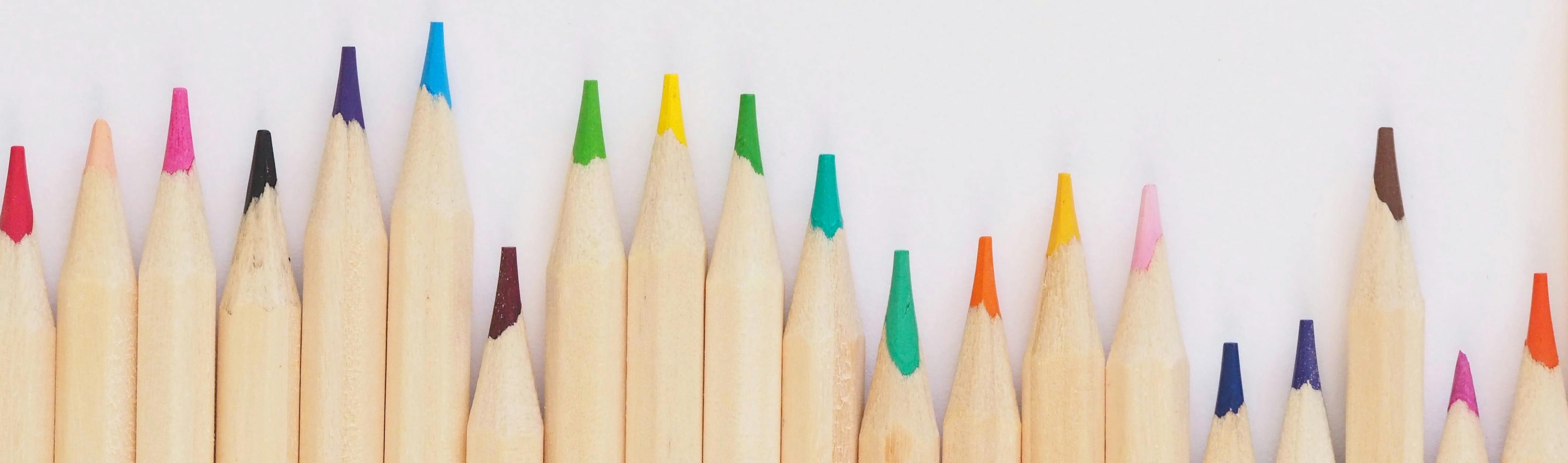 Row of different coloured pencils.