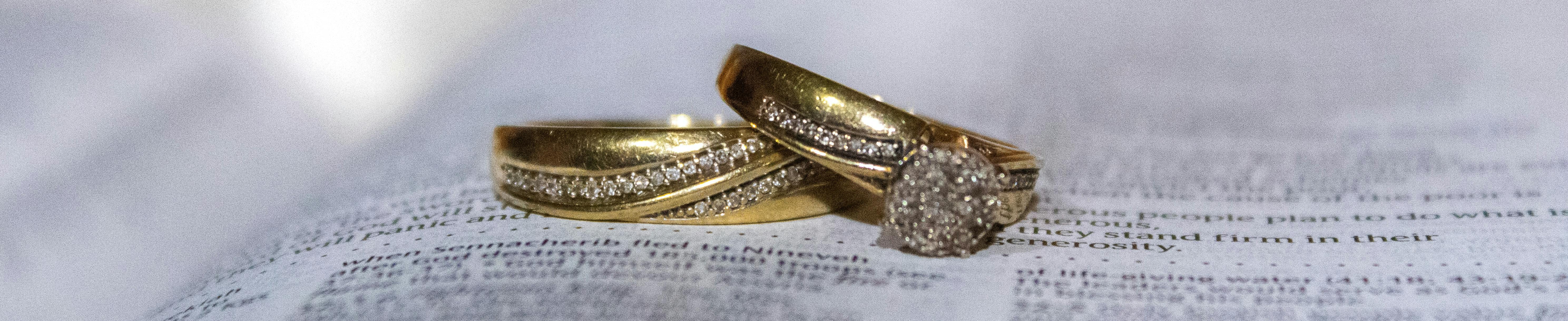 Gold wedding rings on pages