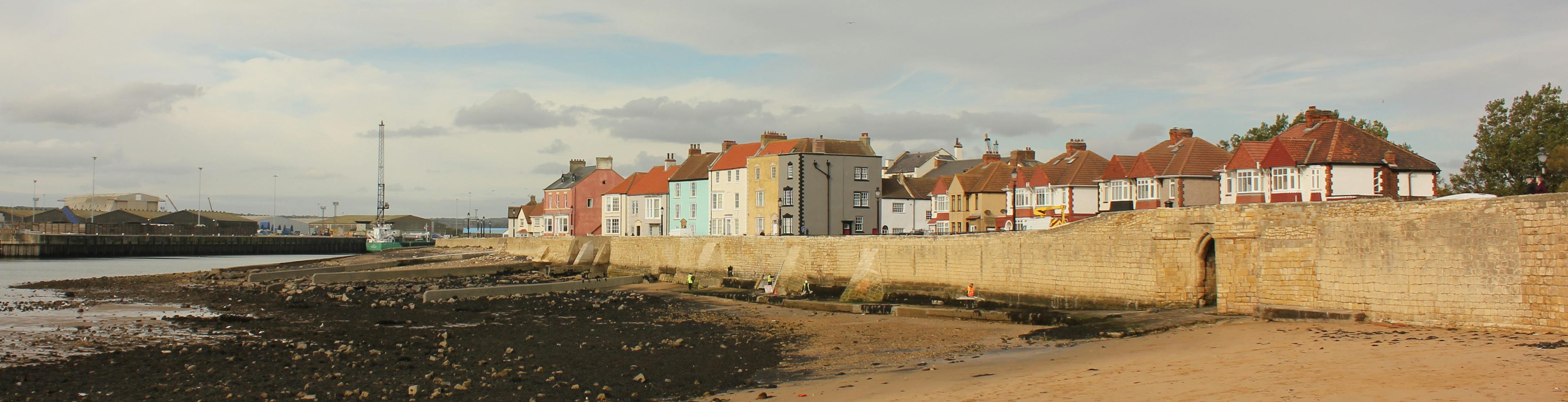 Hartlepool Town Wall from the sea showing the painted houses, St Hilda's Church and Sandwell Gate
