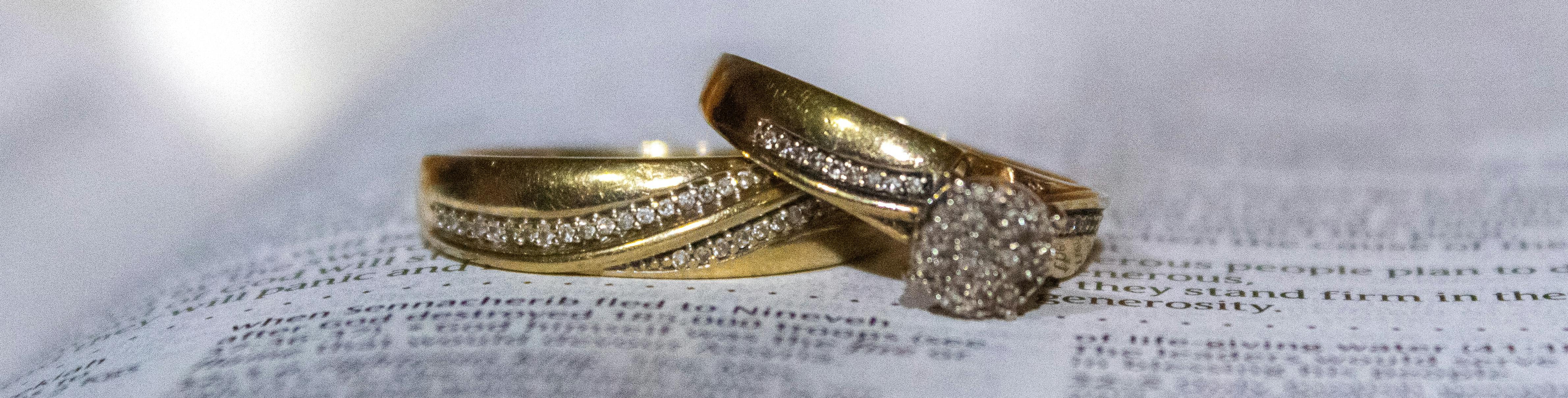 Gold wedding rings on pages