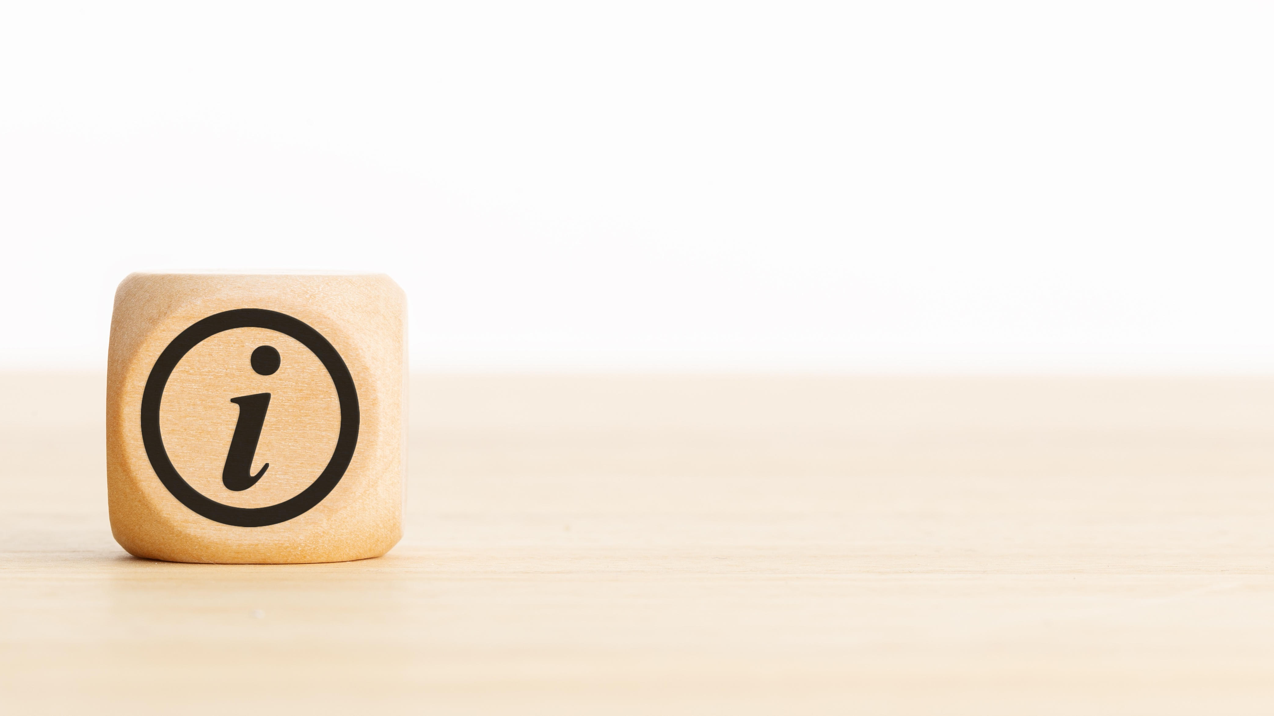Image of dice with an i for information on it
