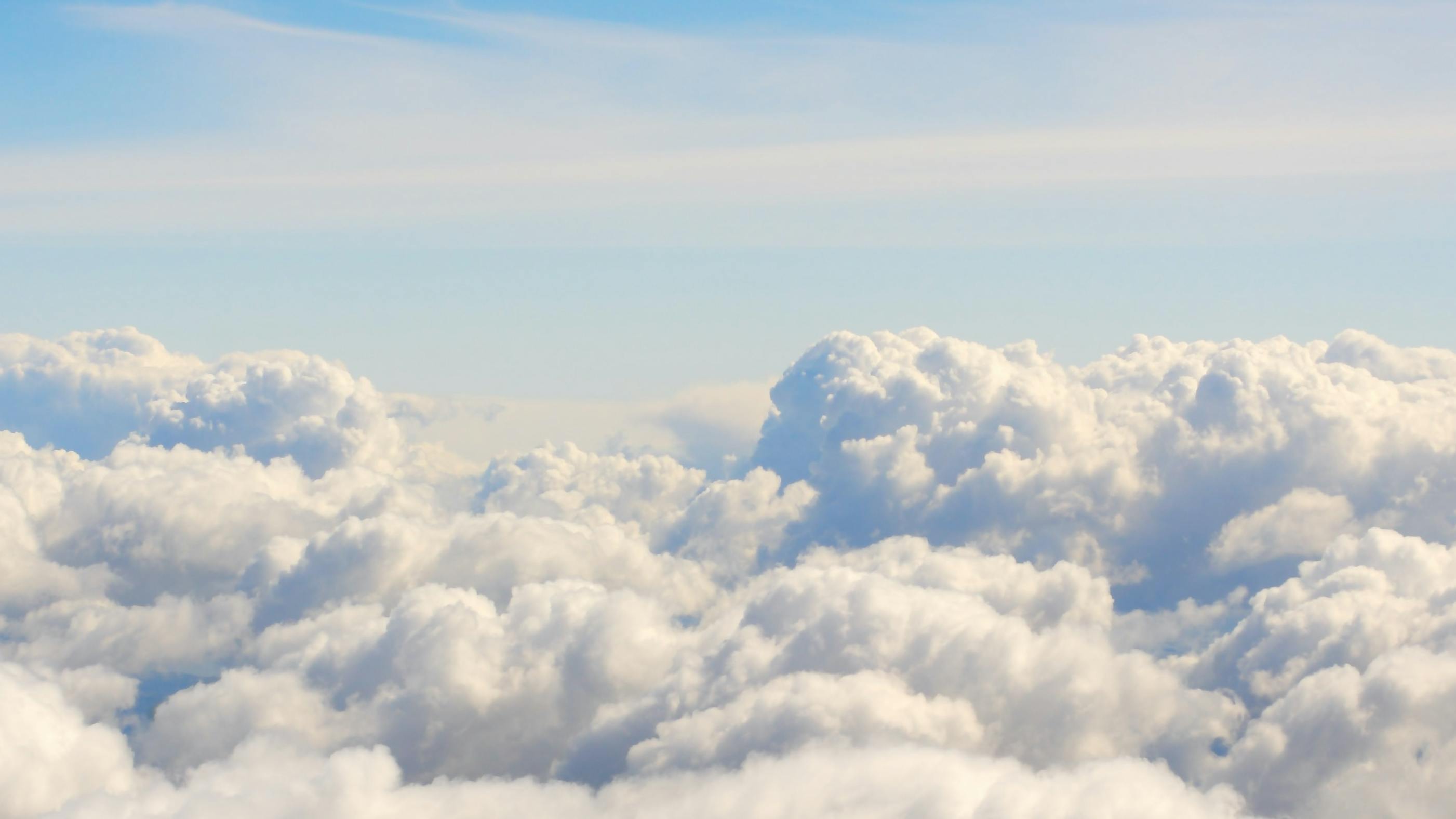 White fluffy clouds against a blue sky