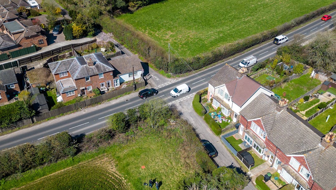 Aerial view of Kent Street and Malling road with cars, houses and fields