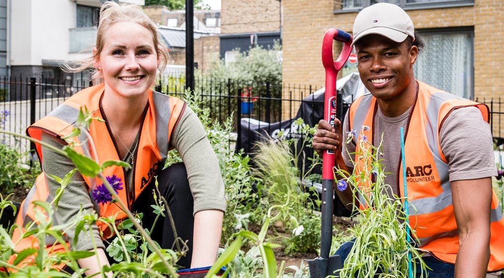 Two volunteers gardening at the Arc centre in Islington