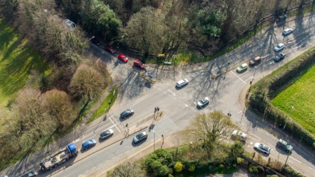 Aerial view of Linton crossroads with trees and houses on either side