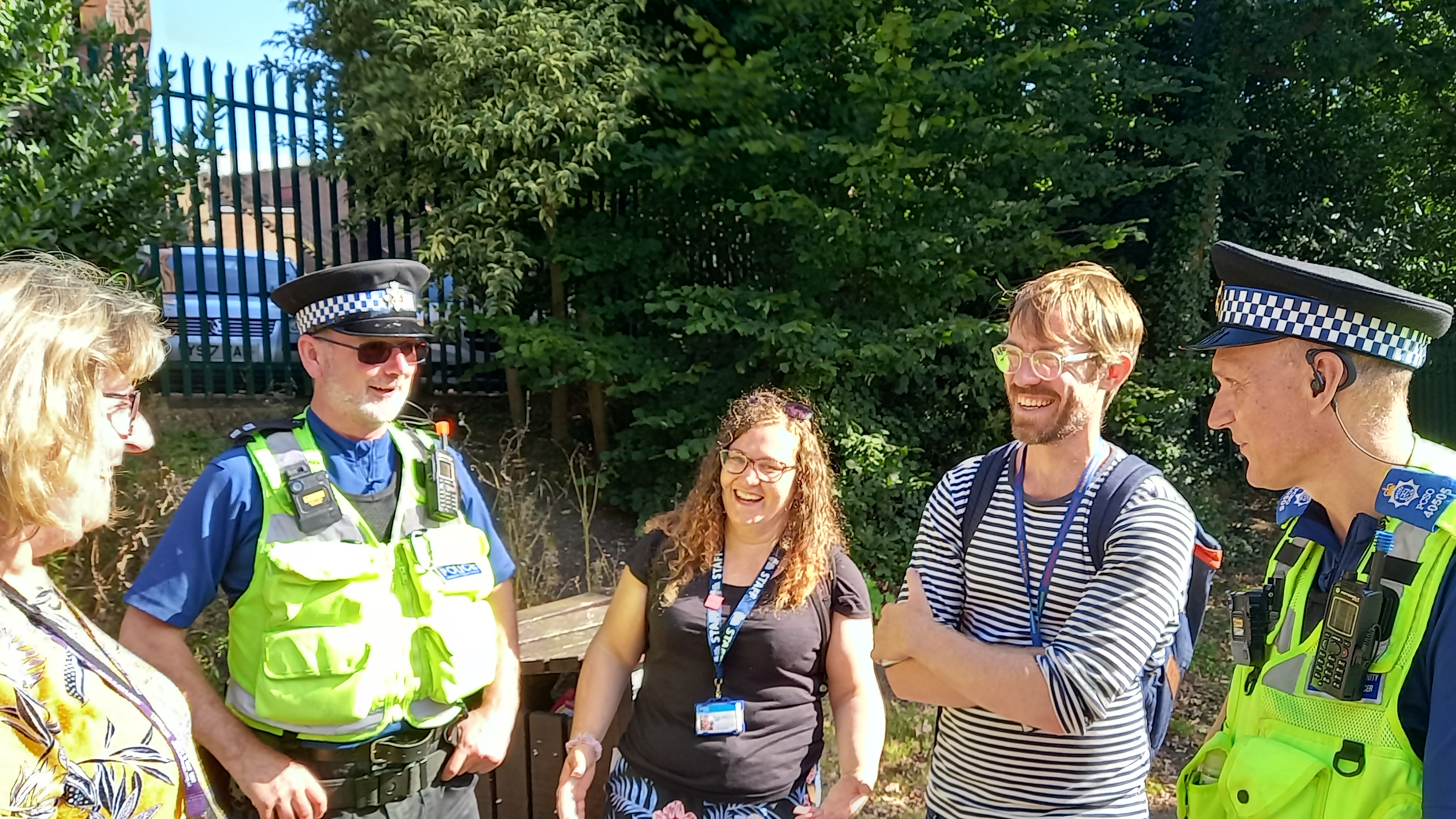 Summer contextual safeguarding image of partner agencies in a group discussion in a park