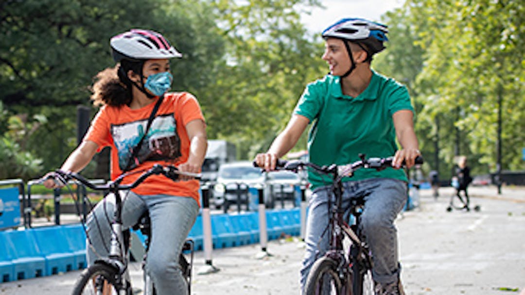 Two people cycling