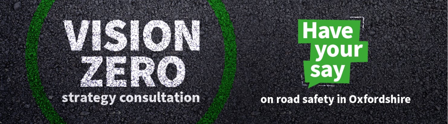 The words 'vision zero strategy consultation' printed in white on tarmac