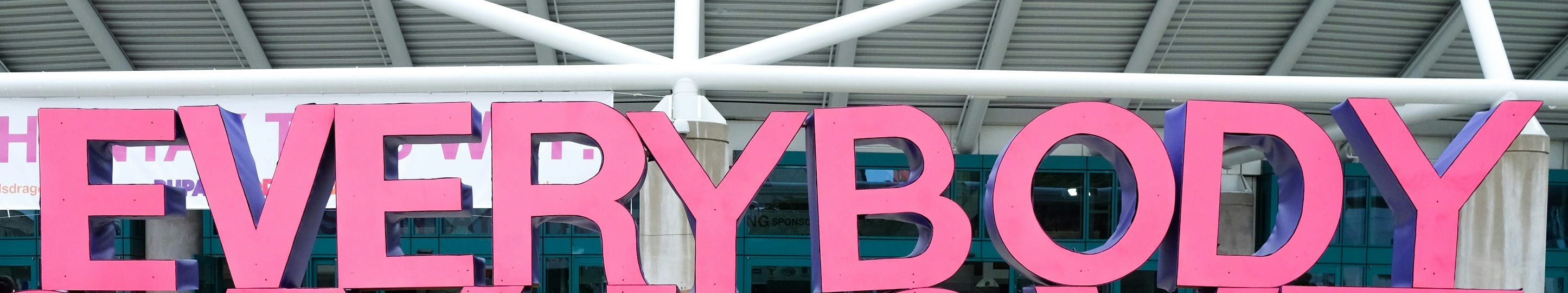 Big pink letters spelling out the word 'Everybody'