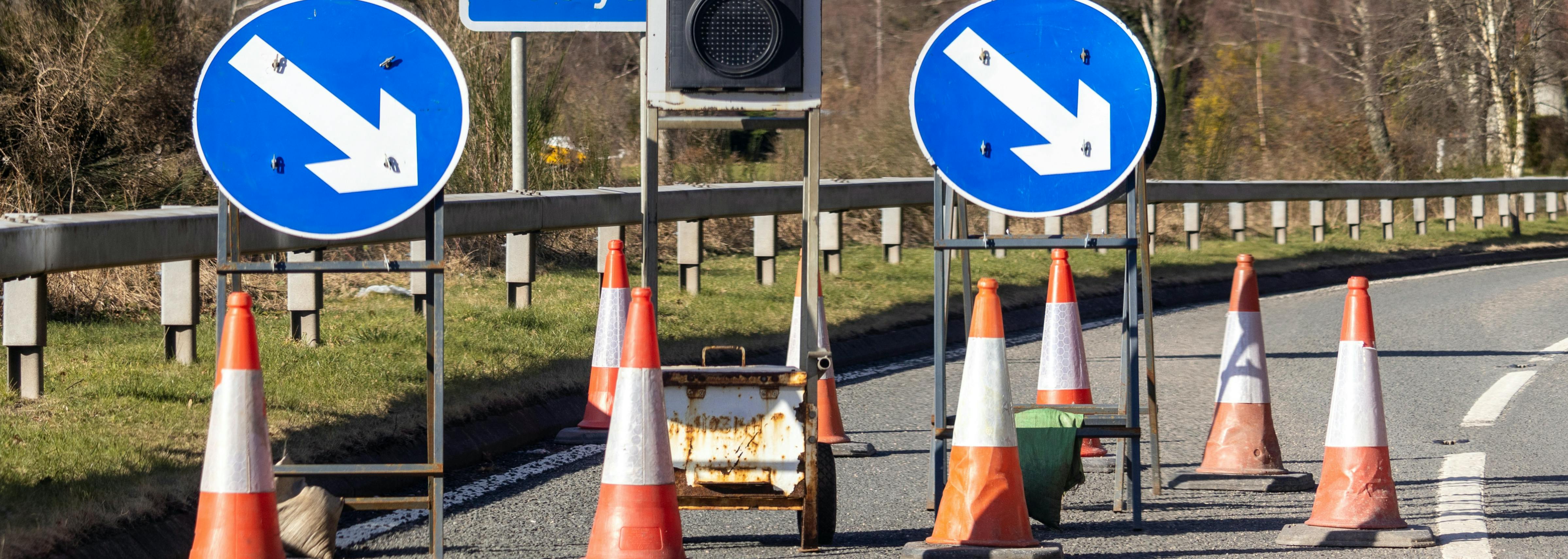 Road works signs with cones