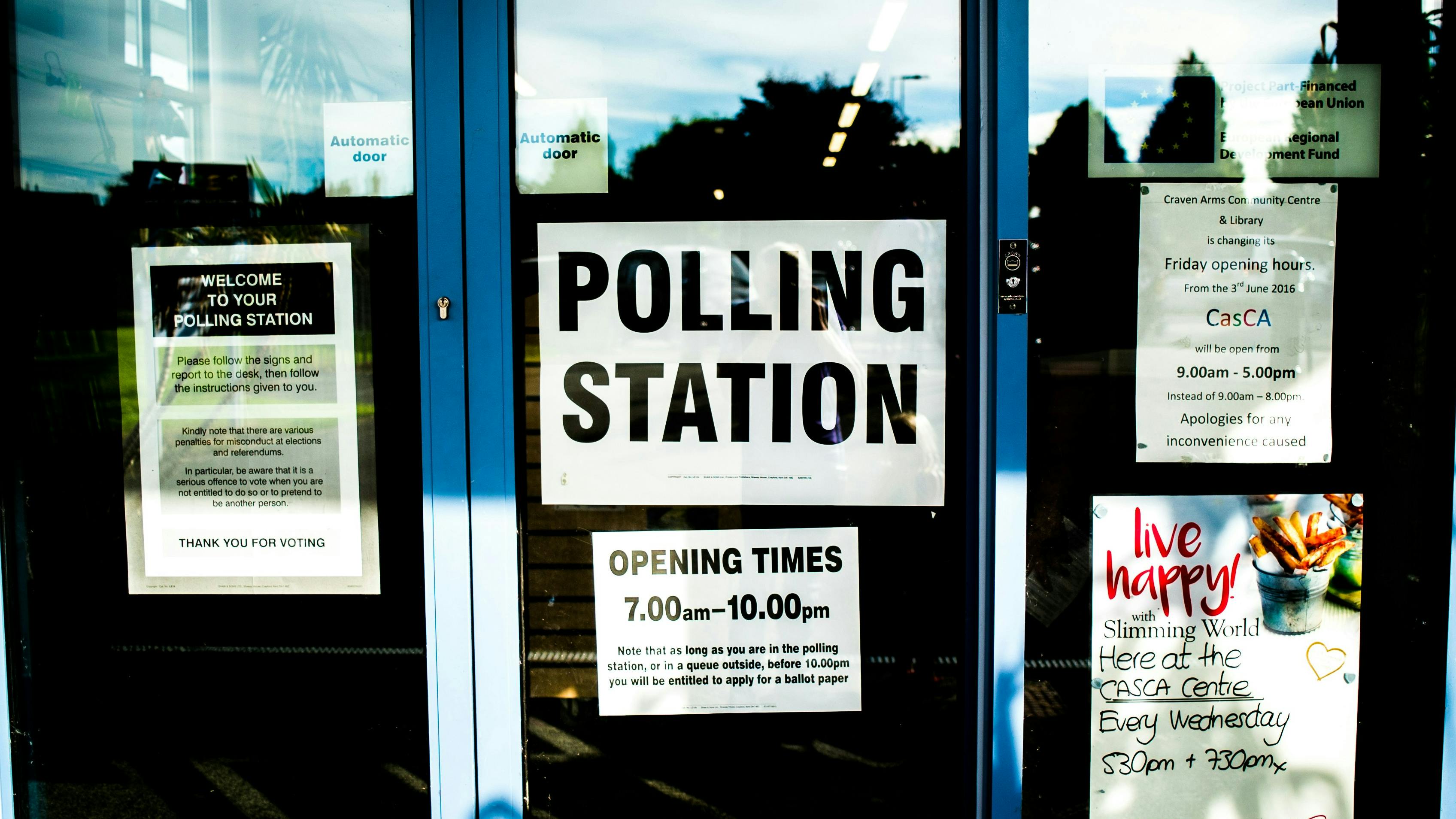 A doorway displaying a "polling station" sign