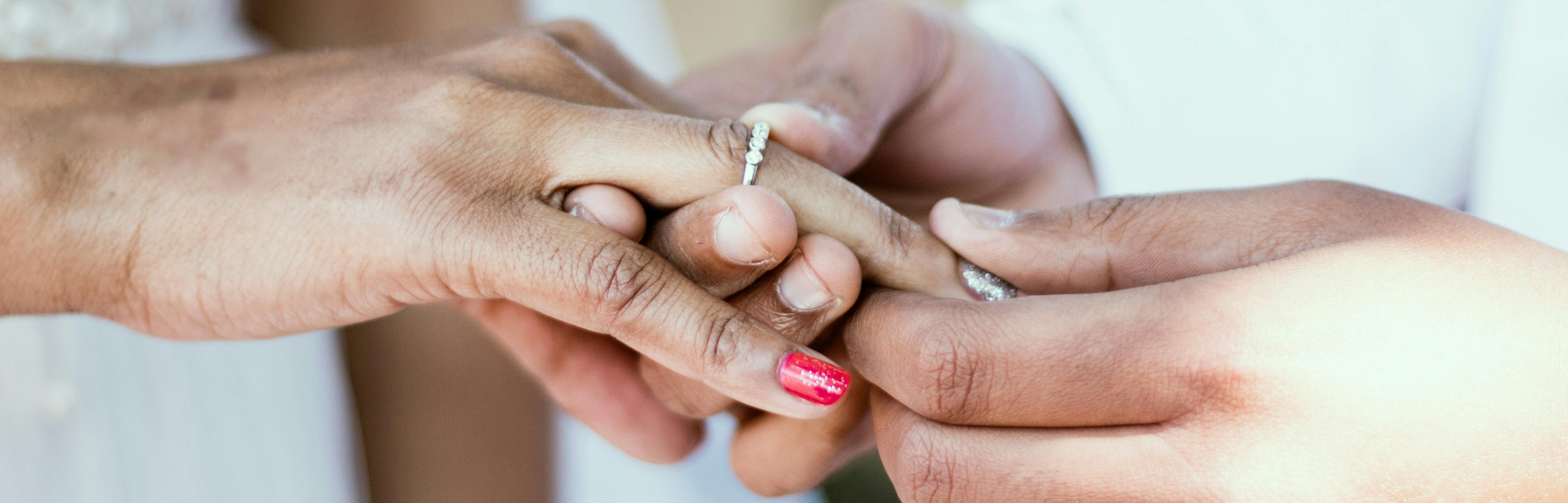 Bride and groom exchanging rings