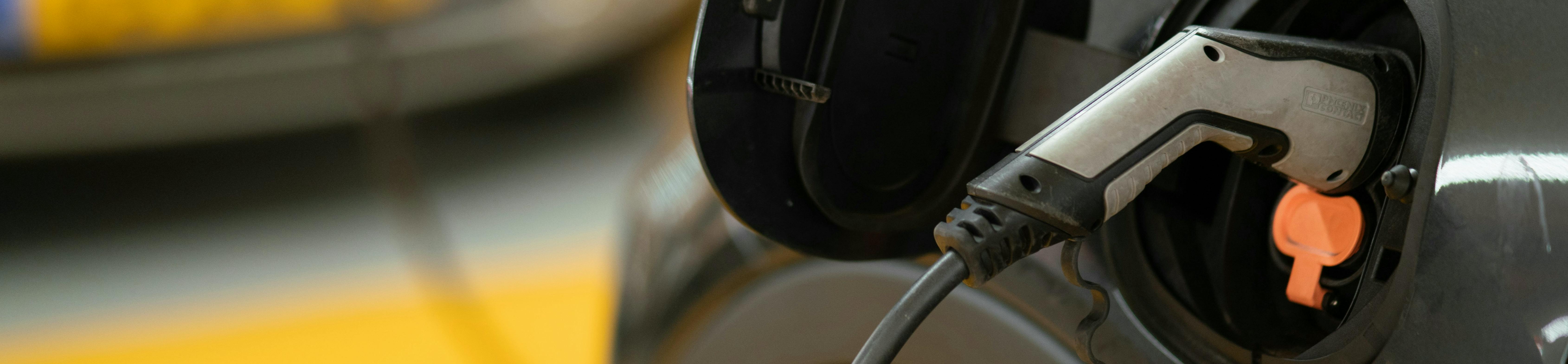 Close up of a black electric vehicle charging