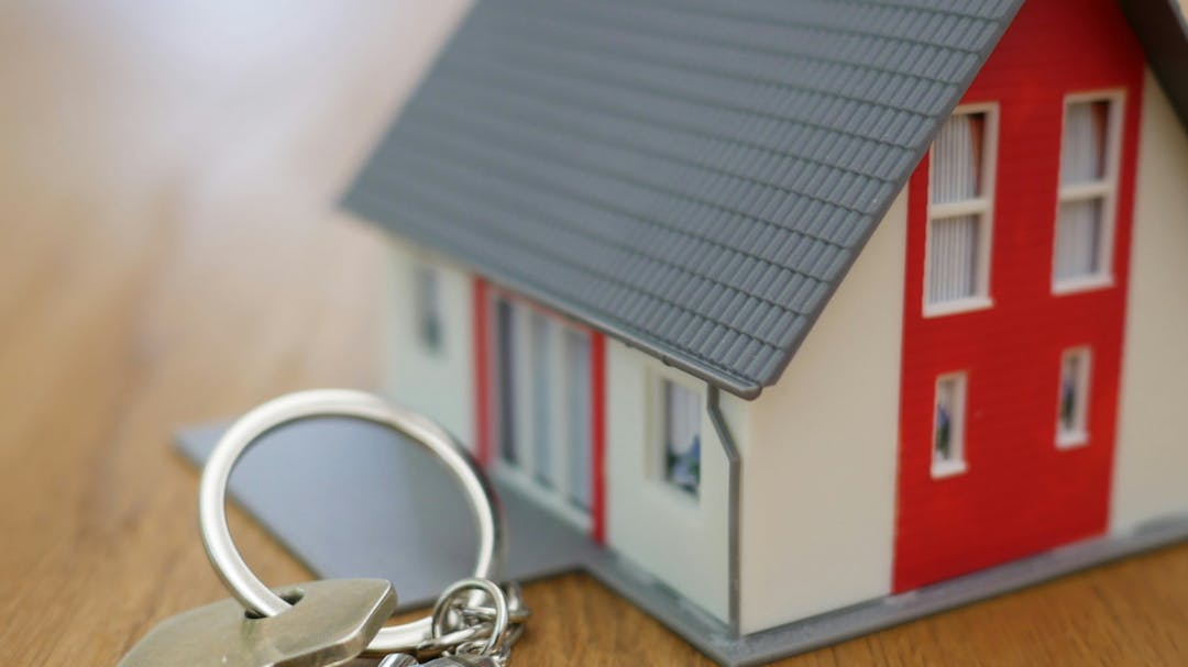 Picture of a house with wording "Your Housing Your Voice" around it