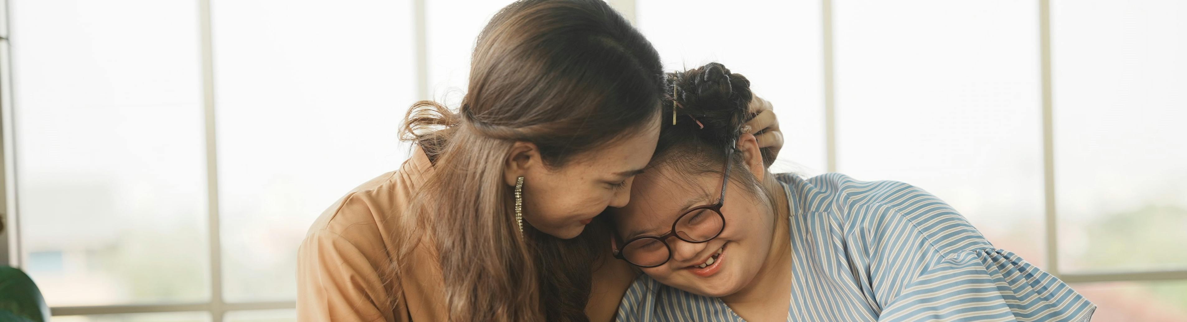 Mother and SEND daughter smiling