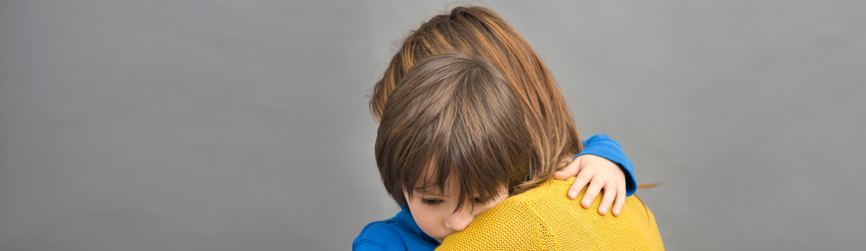 Woman hugging young boy