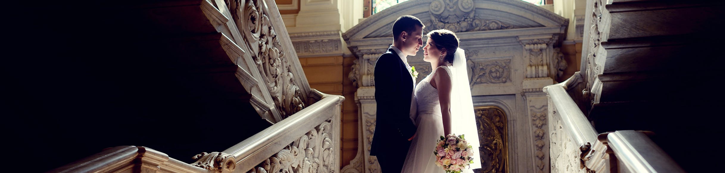 Wedding bride and groom on long staircase