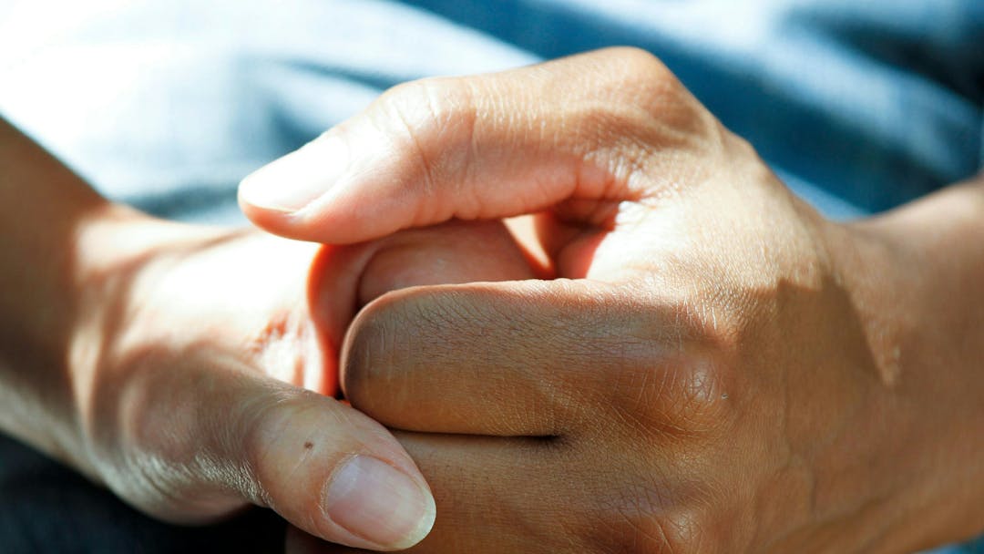 Carer holding a patience hand 
