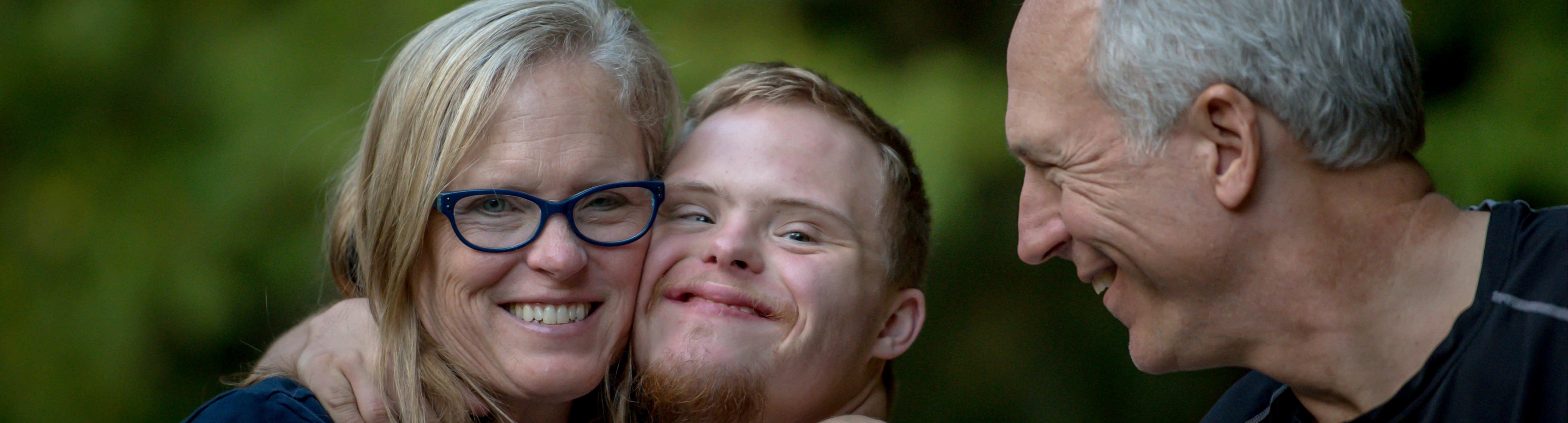 Three people smiling 