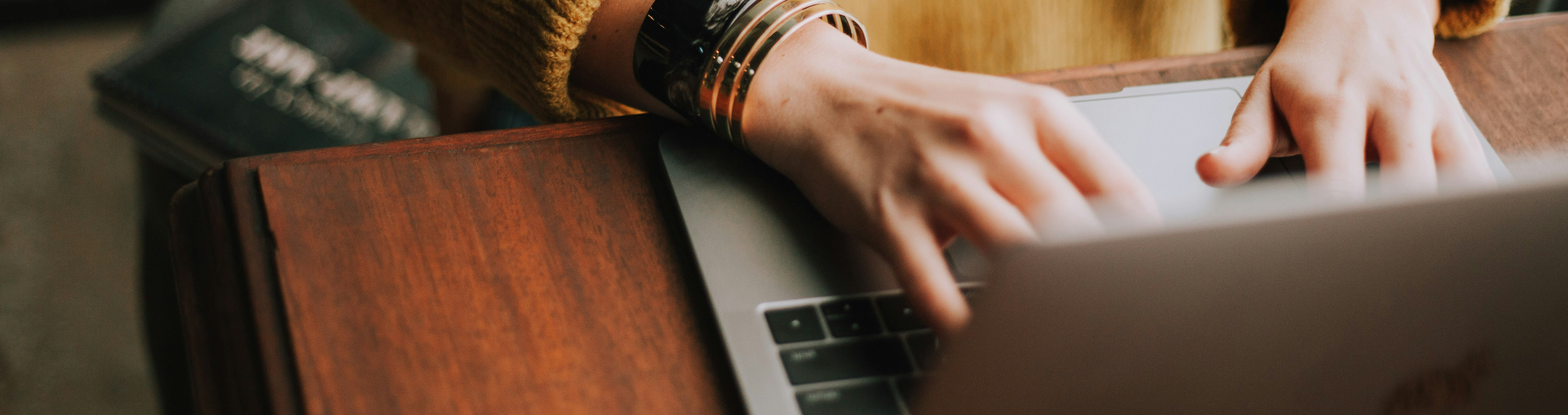 User undertaking a survey on laptop