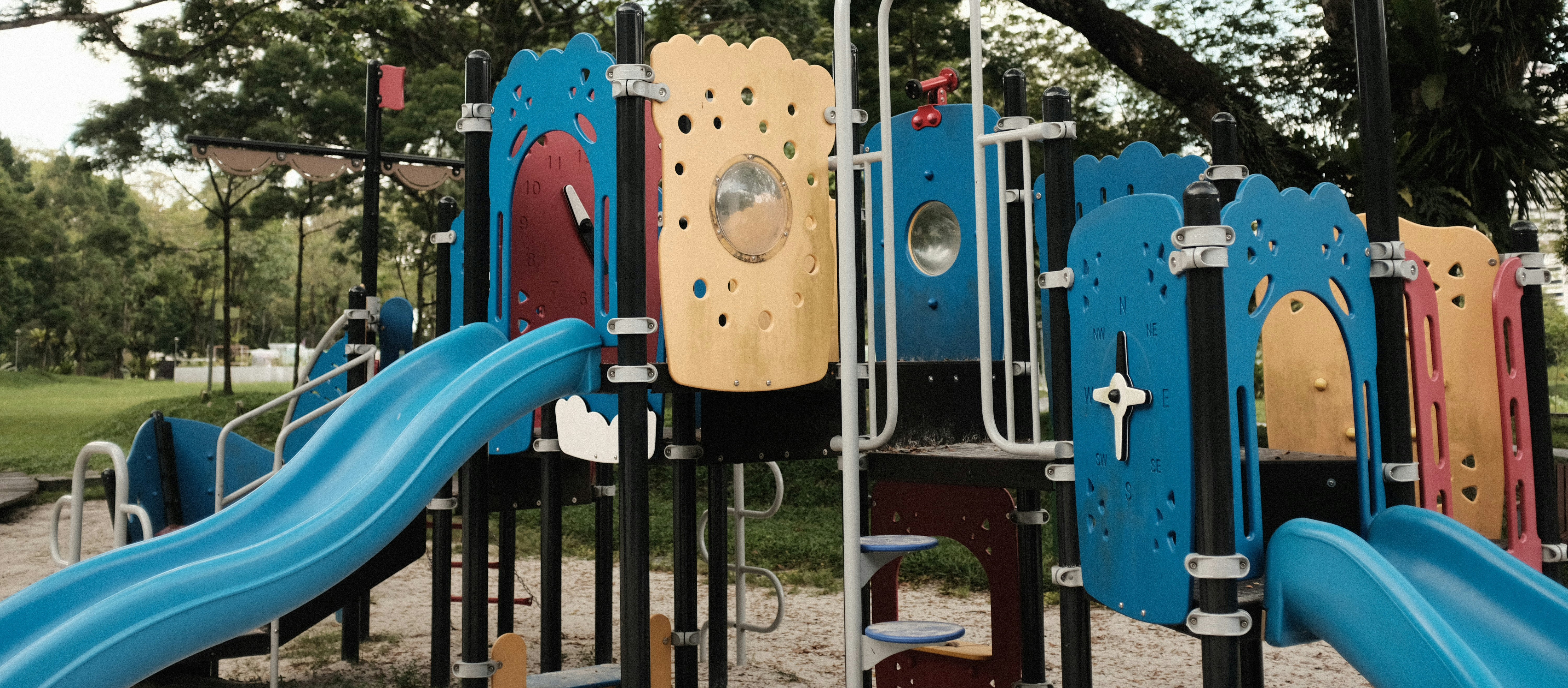 Stock image of outdoor climbing frame with slides