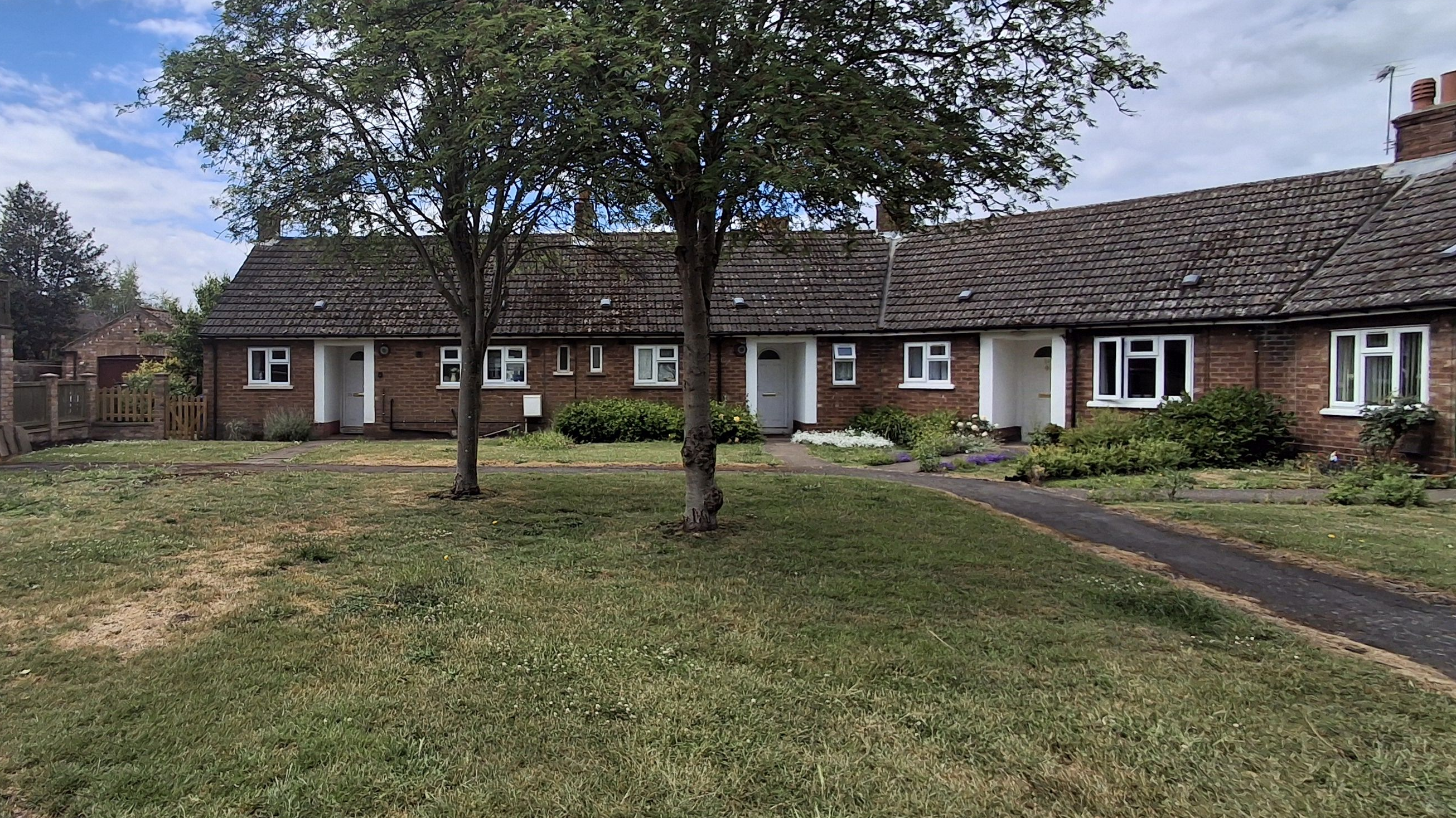 Your Voice Blyton and surrounding with a drawing of a woman in front of a house