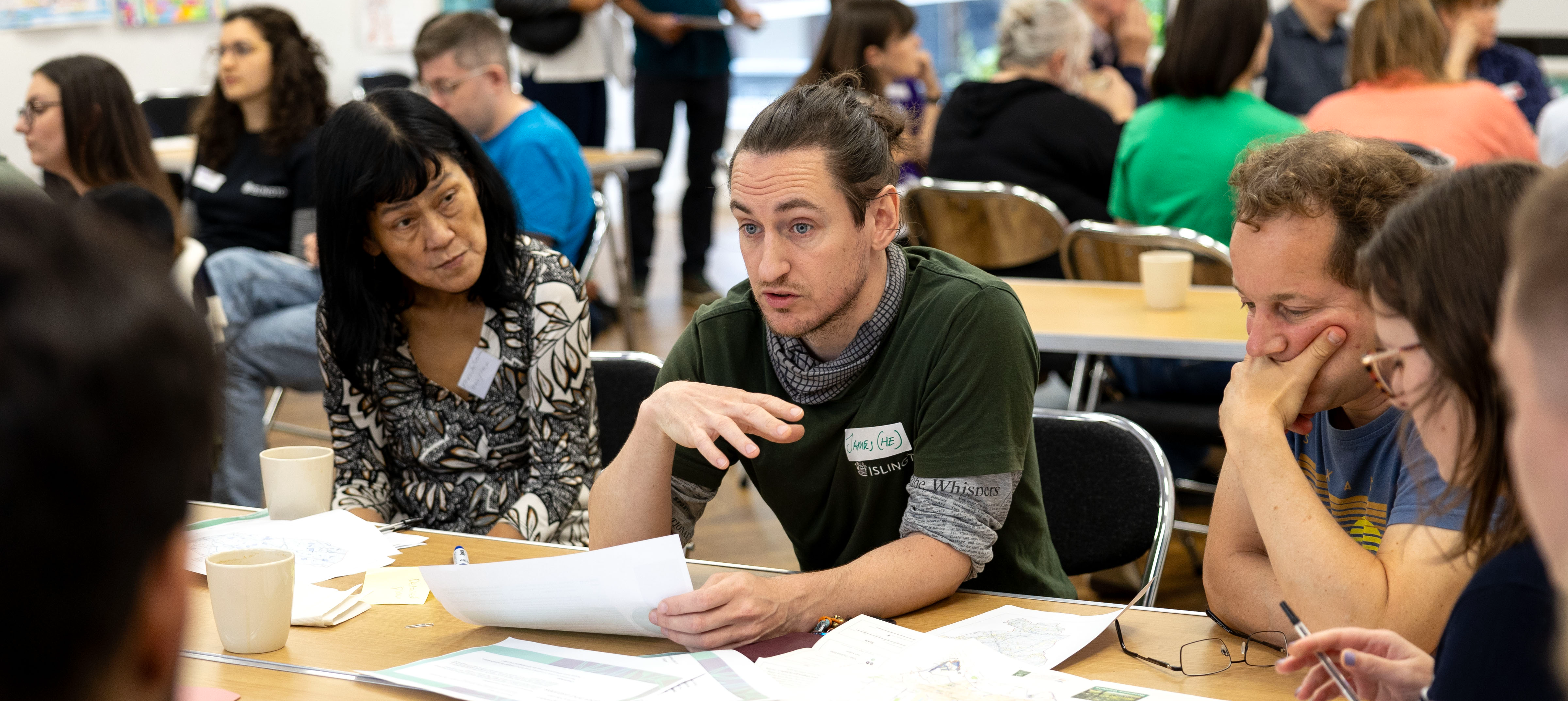 A man and woman having a conversation at the Islington Climate Panel workshop 