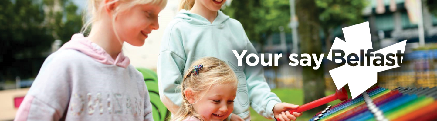 Photo of children playing a colourful xylophone with text reading Your say Belfast