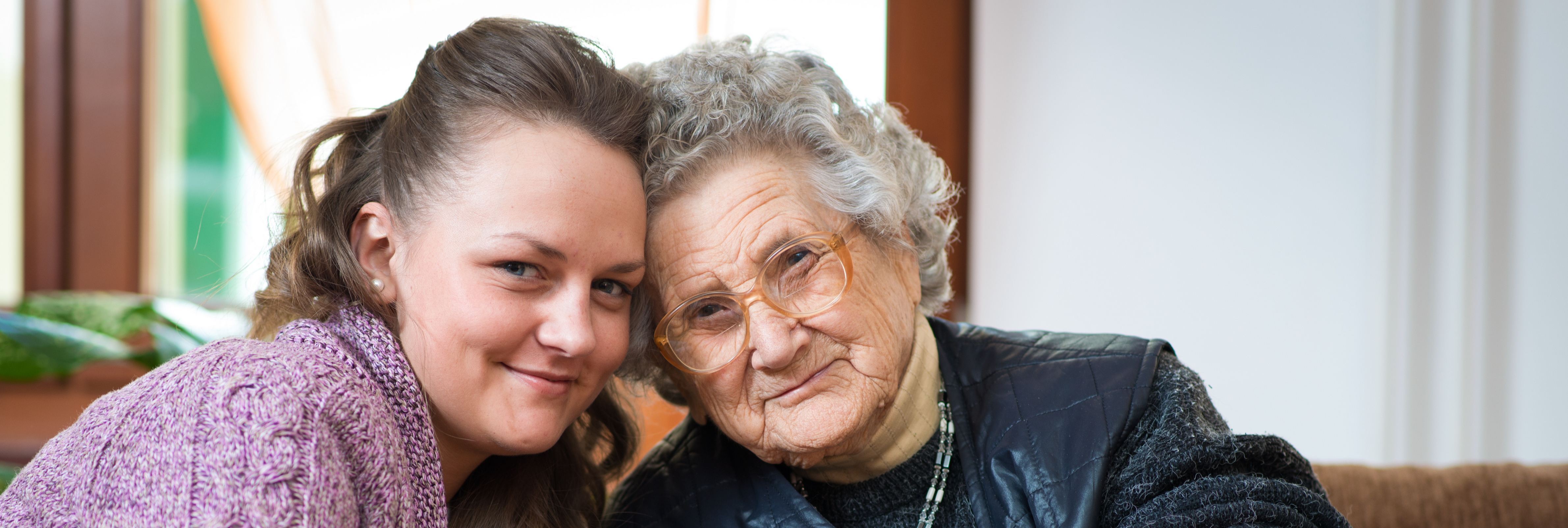 Older lady hugging younger lady