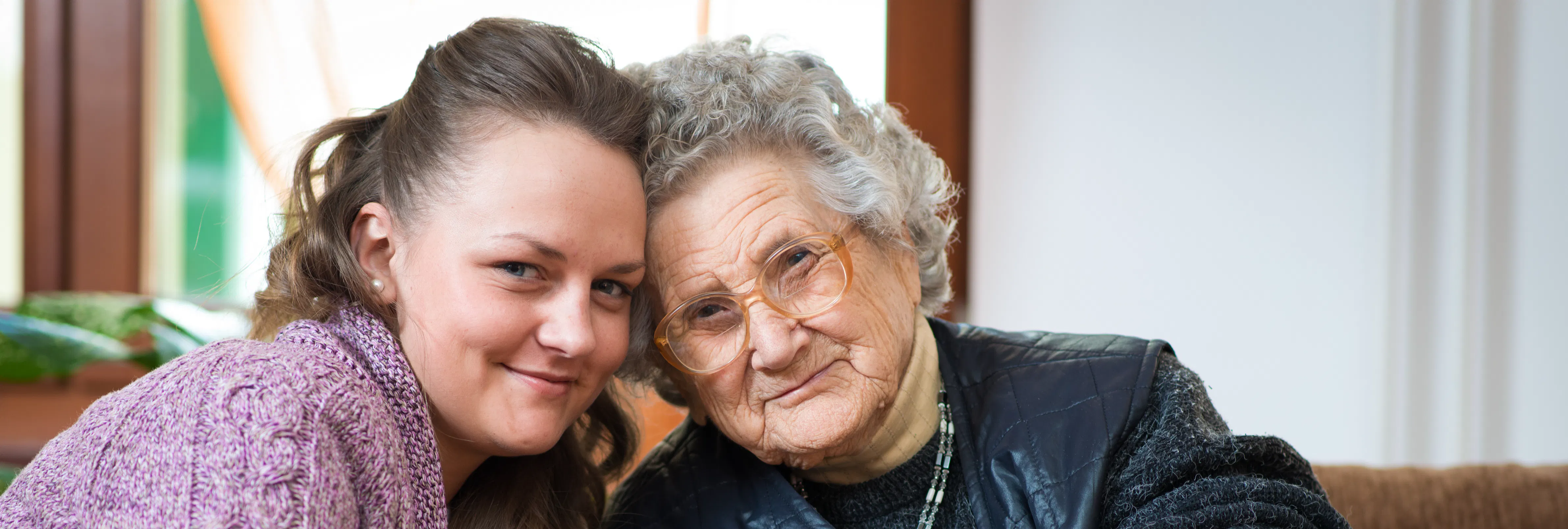 Older lady hugging younger lady