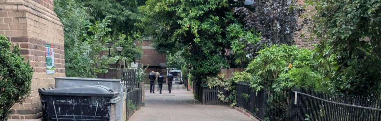 View on Loraine Estate looking towards Buckmaster blocks. Three Parkguard officers patrolling