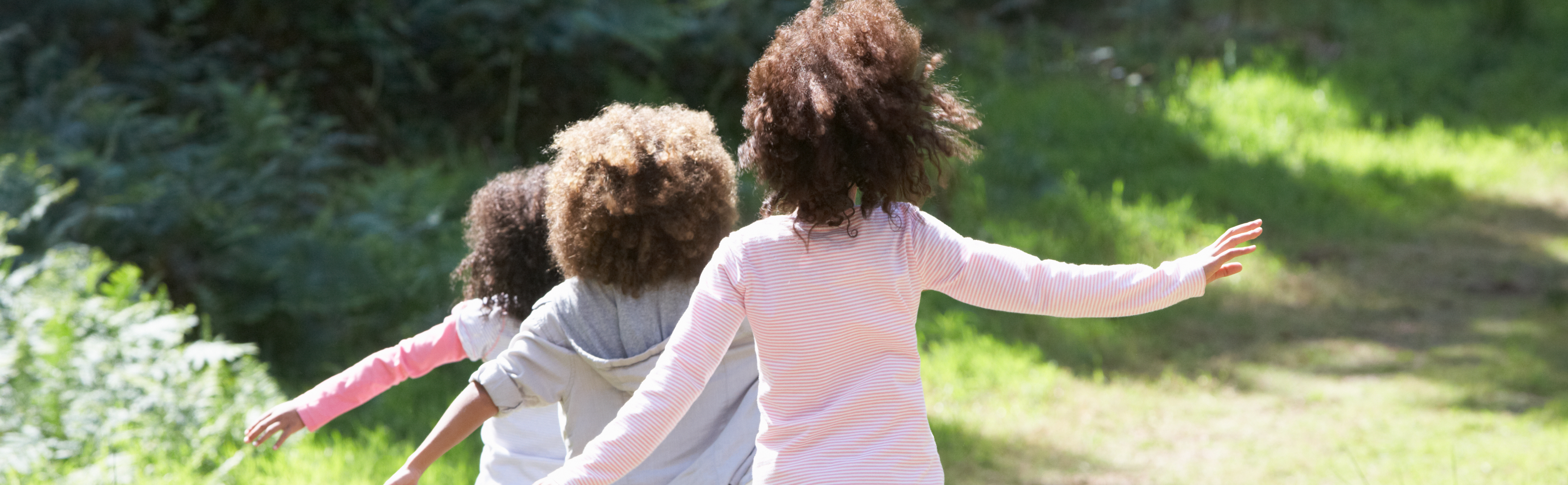 Children running through a field
