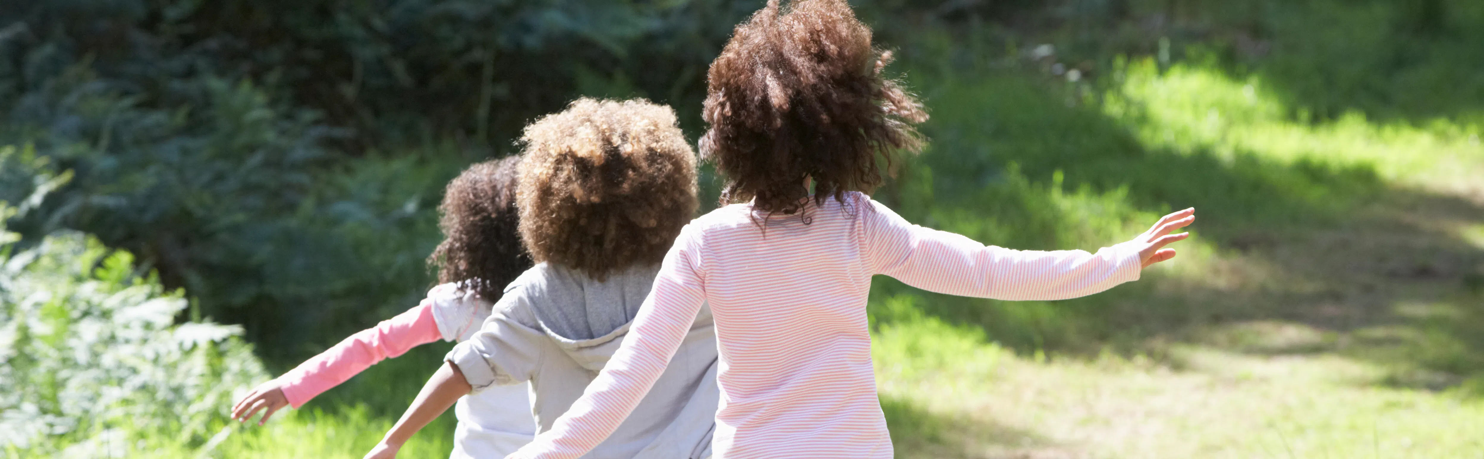Children running through a field