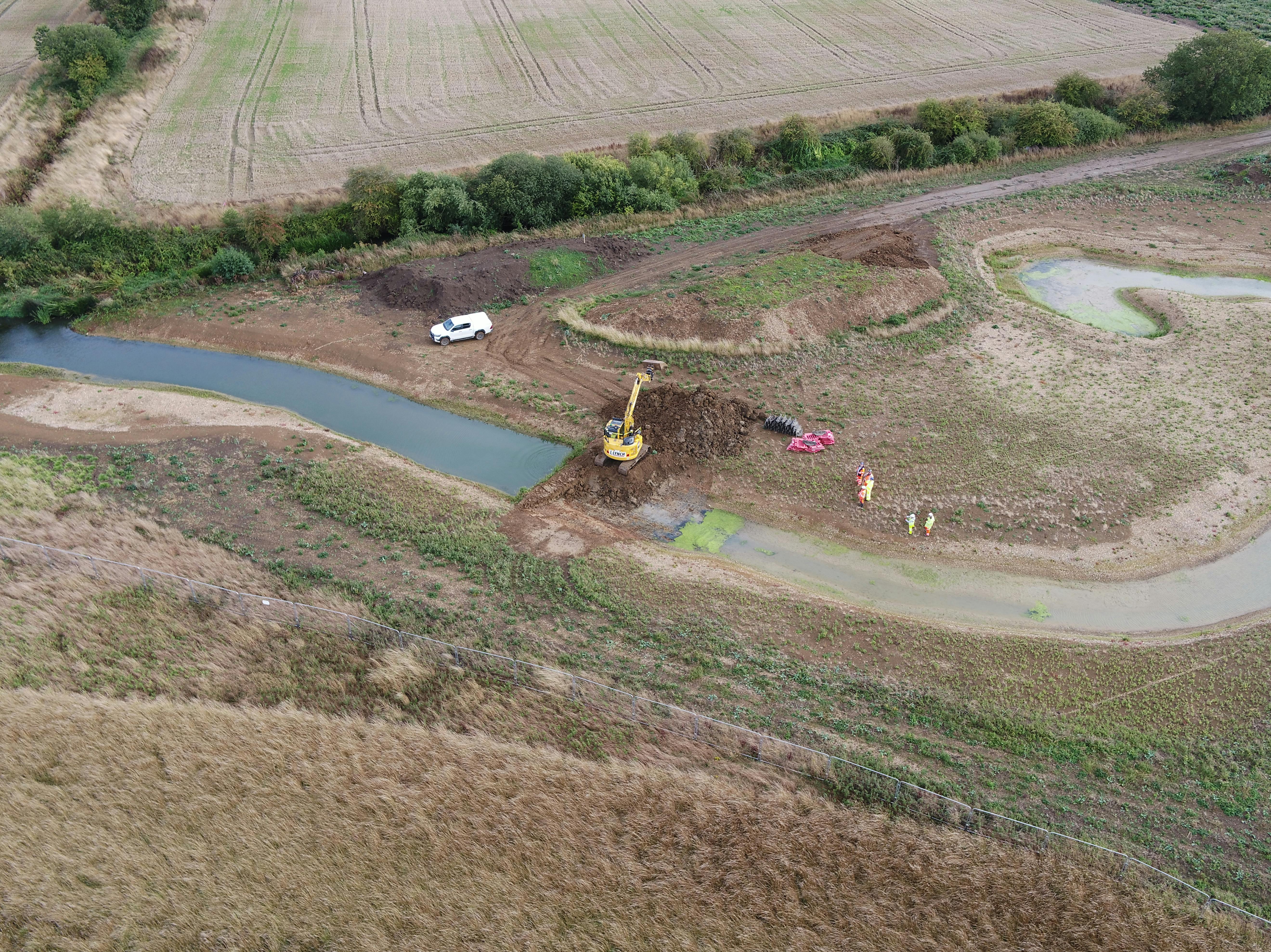 2. Removing the earth bund to divert the river through the new channel - 11.09.2025.JPG