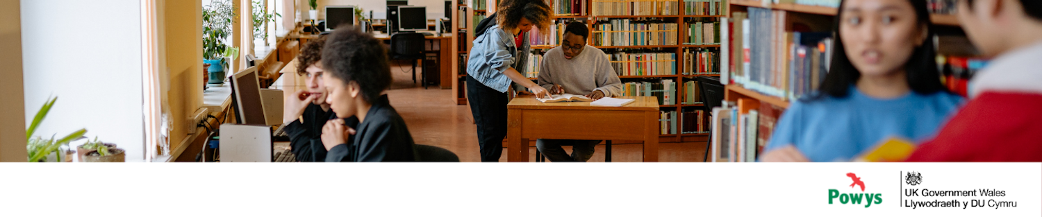 Image of six people using a community library with the Powys County Council and UK Government Wales logos in the bottom right