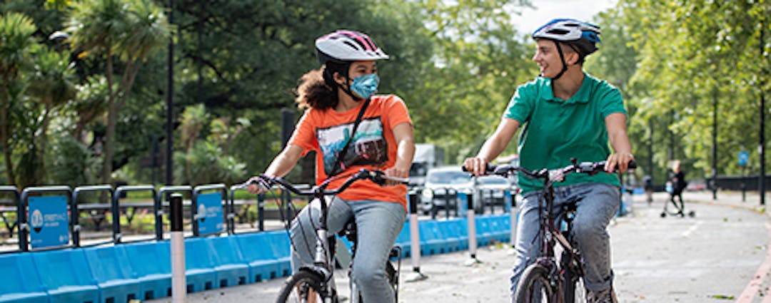 Two people cycling