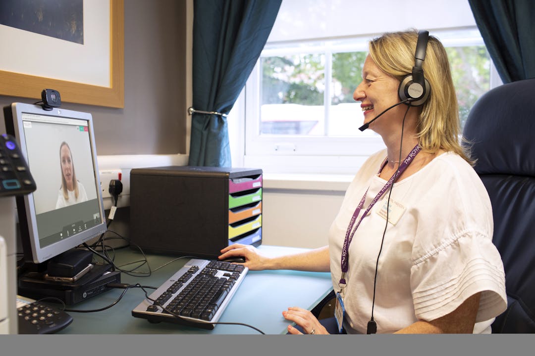 NHS Consultant in video call with patient