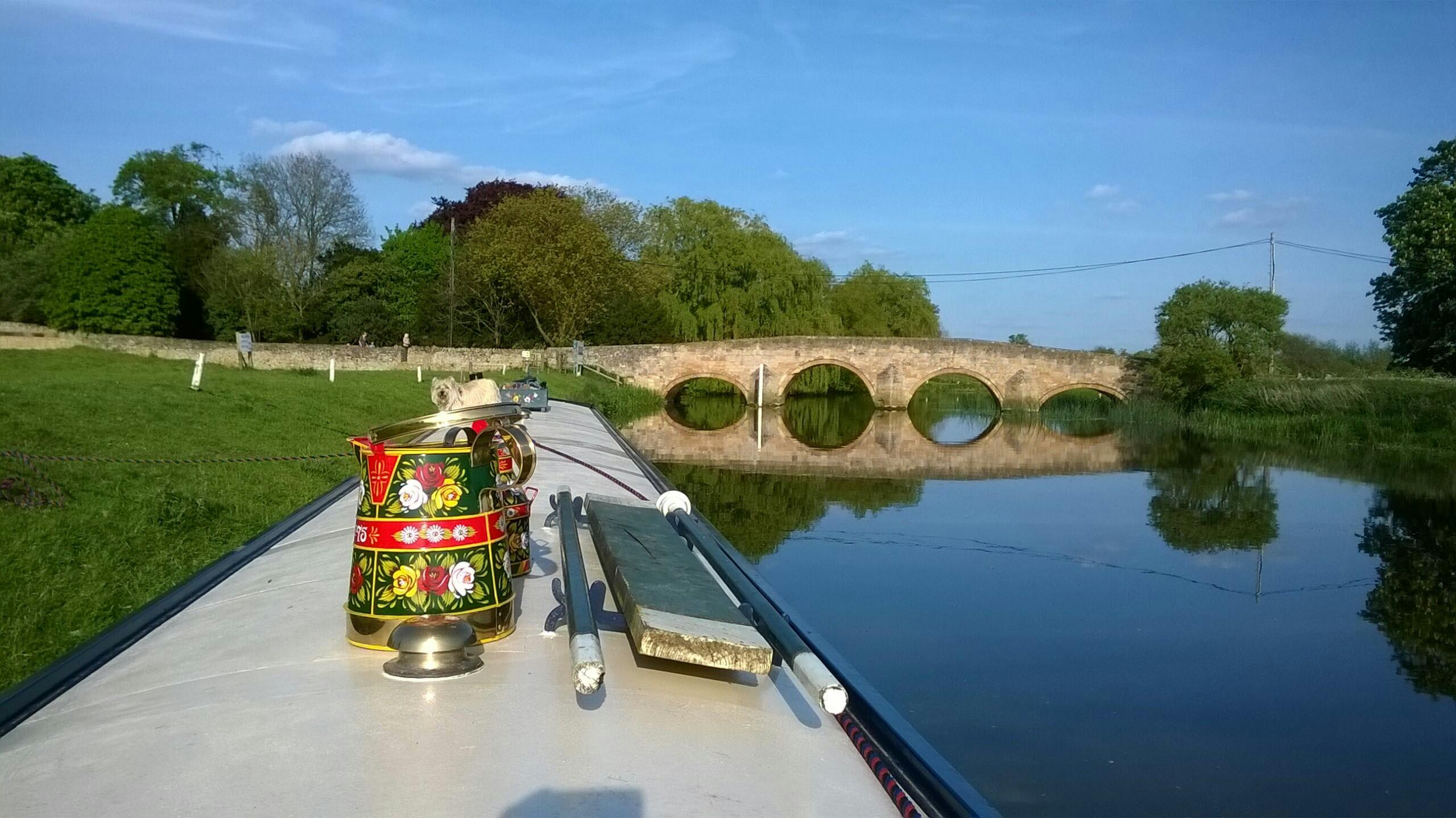 Image showing the River Nene, Thrapston Nine Arches Bridge and a moored narrow boat. 