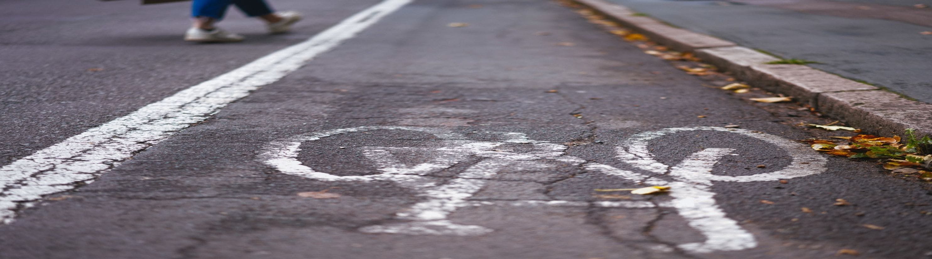 Photo of cycle lane with painted pedal cycle symbol.