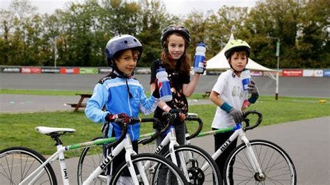 Children learning to ride