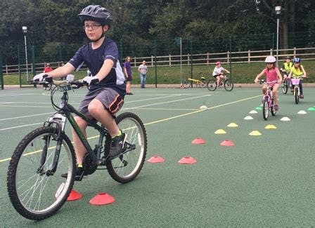 Children learning to cycle