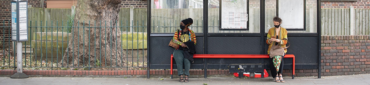 Image of people waiting at a bus stop