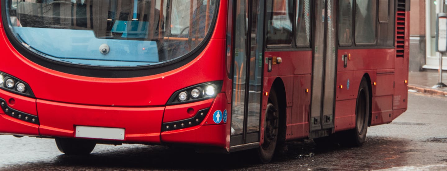 Close up of bus driving along the road