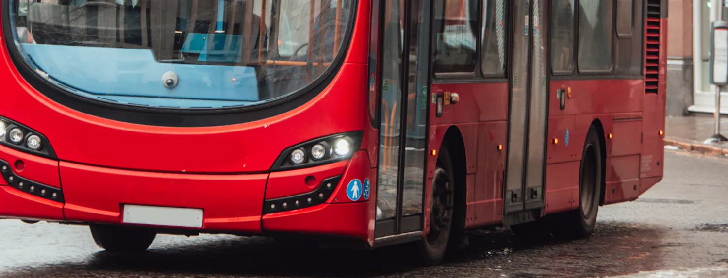 Close up of bus driving along the road