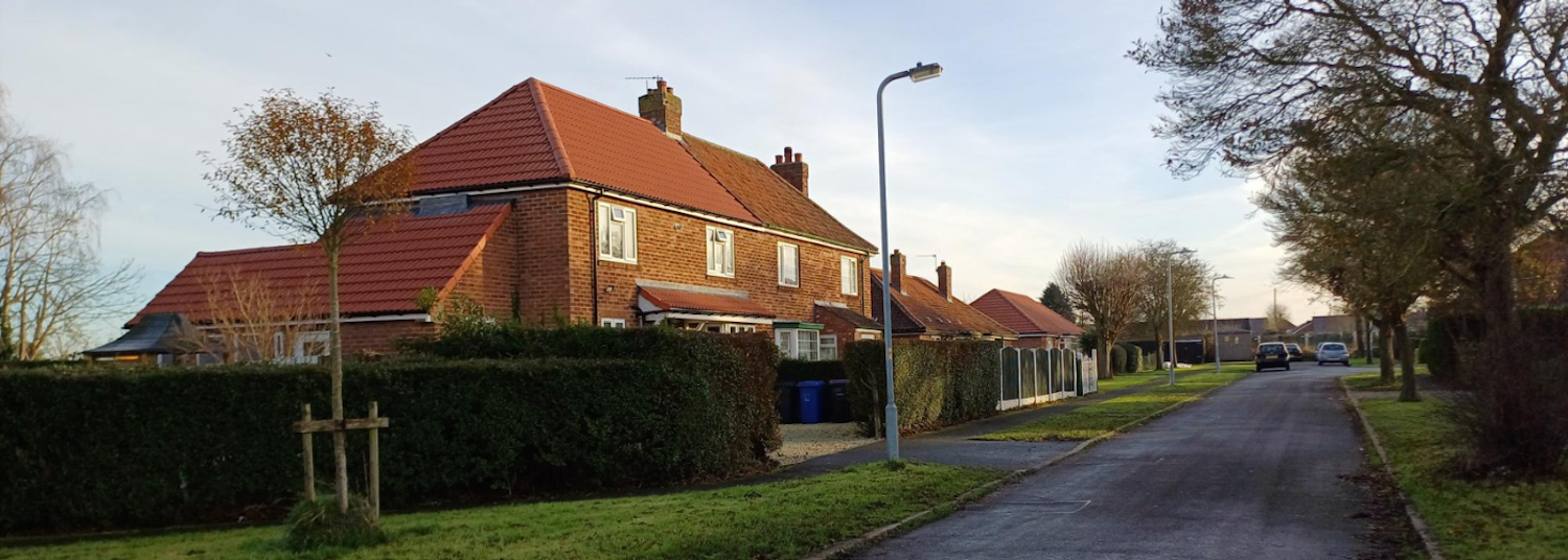A street of houses in the morning sunshine